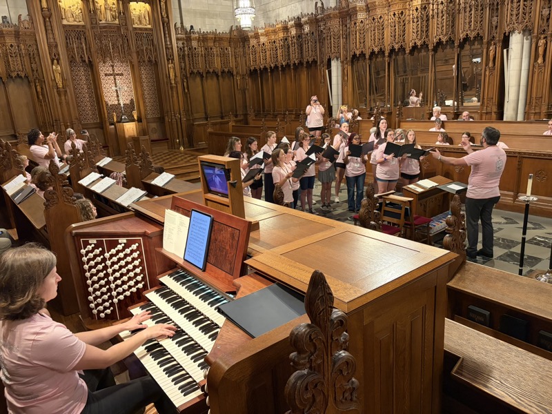 The course organist at the Duke Chapel console during rehearsal
